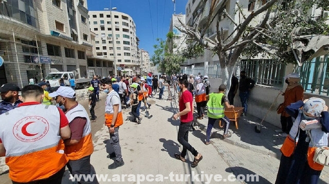 أهالى غزة يواصلون حملة "حنعمرها" لإزالة آثار العدوان